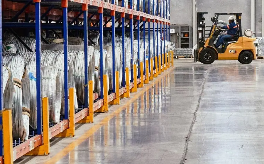 Forklift between warehouse racks